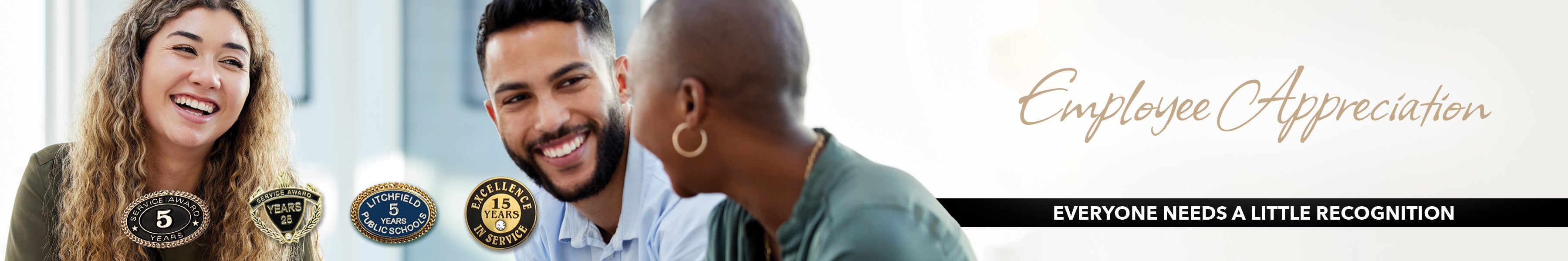 Happy employees after receiving anniversary awards to recognize their years of service.