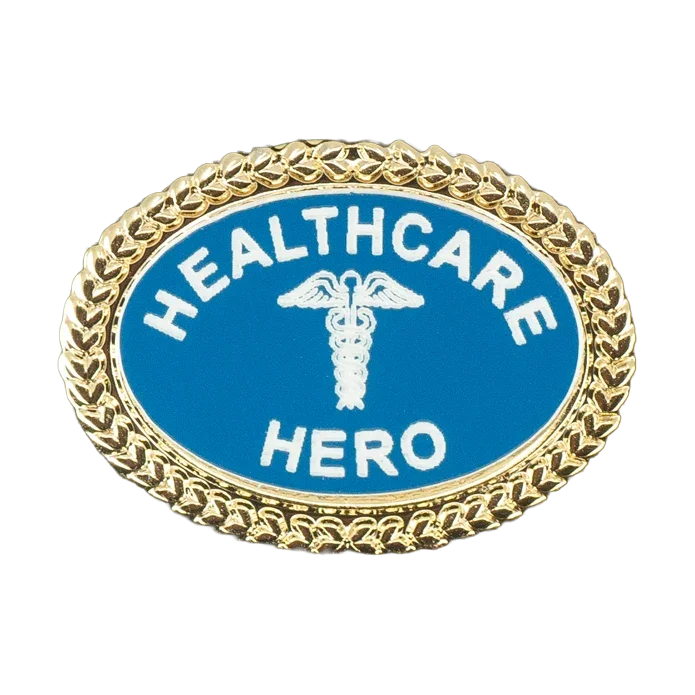 An oval-shaped laser engraved pin with a gold-tone chain-link border, featuring a blue center with the words 'HEALTHCARE HERO' in white and a white caduceus symbol in the middle.