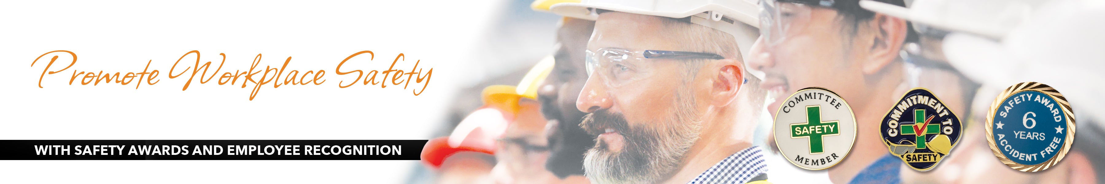 Employees with hard hats receiving safety award pins for accident free workplace.