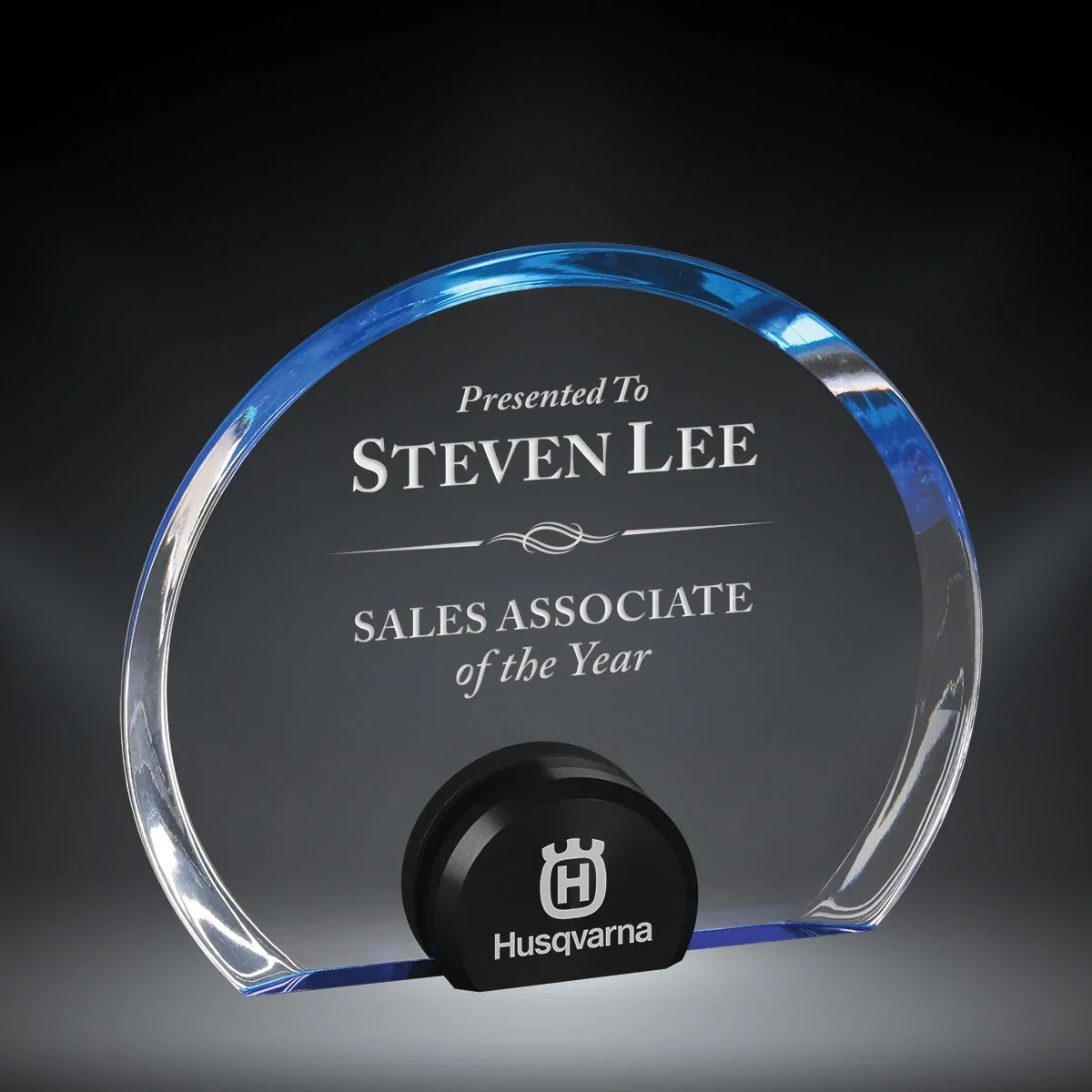 Halo Circle Acrylic Award from AwardsHere, clear acrylic with blue accent, engraved for Steven Lee on a black Husqvarna base.